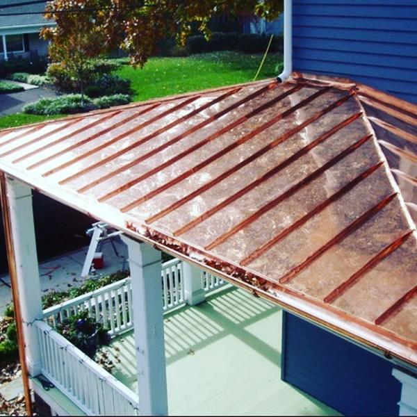 Copper roof and gutter detail on a covered porch
