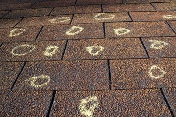 Close-up of hail damage on asphalt shingles